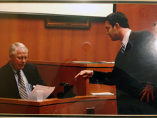 Trial attorney Tim Mcilwain cross examines Flyers GM Bobby Clarke